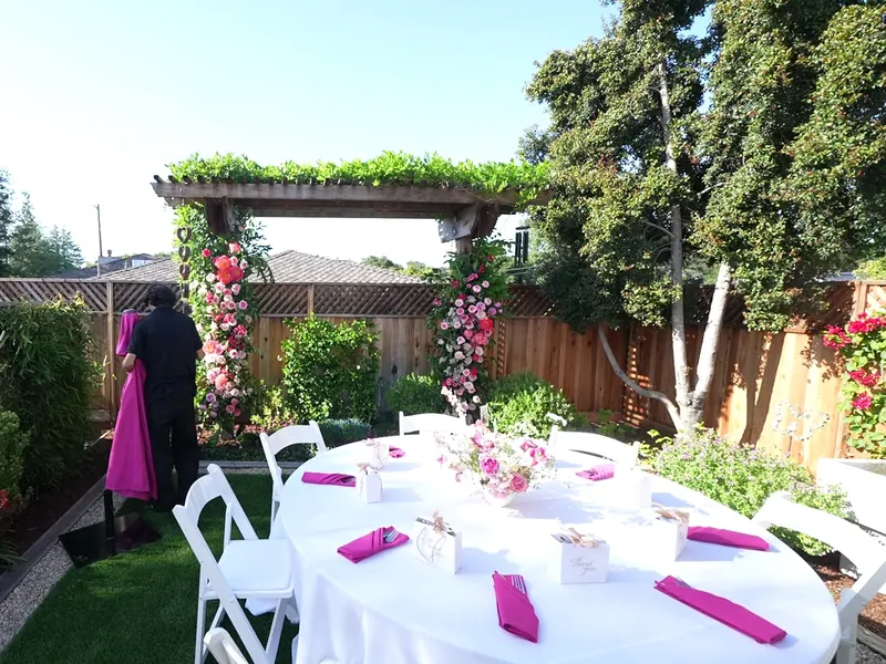 Garden party tables set with linens and florals for a Santa Clara event