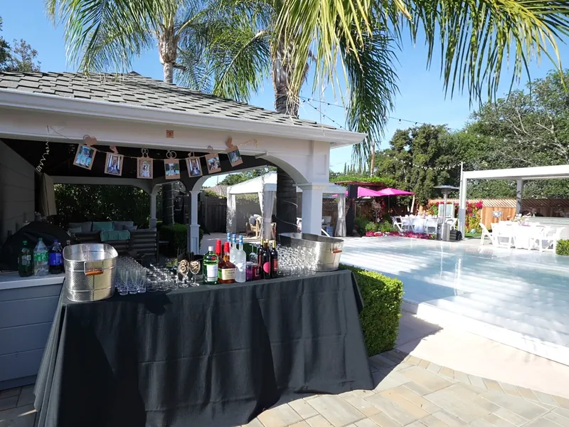 Poolside bar and beverage setup for a Campbell backyard event