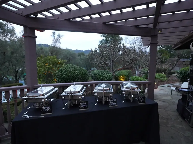 Covered patio buffet staged for a Los Altos backyard dinner