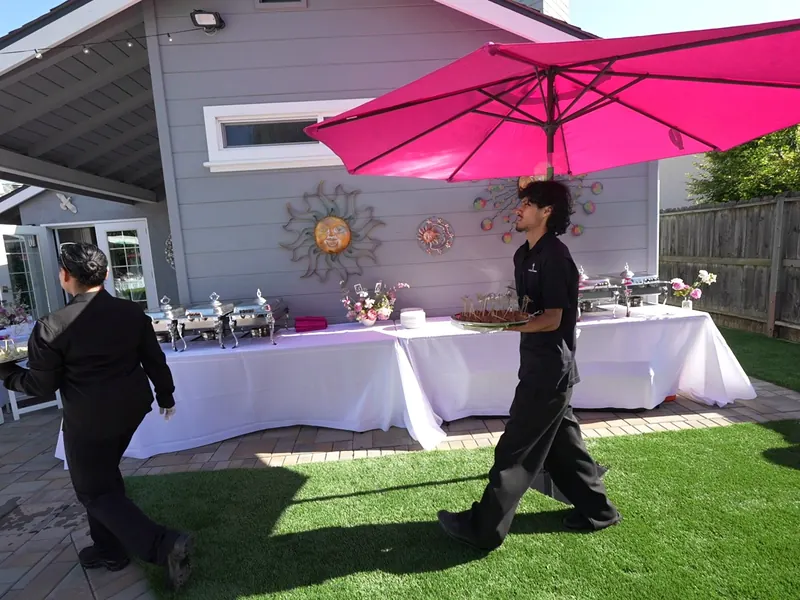 Crew setting up the buffet before guests arrive at a Los Gatos event