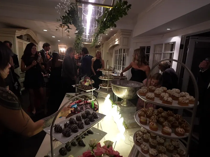 Dessert buffet of petite sweets set out at the end of a San Jose party