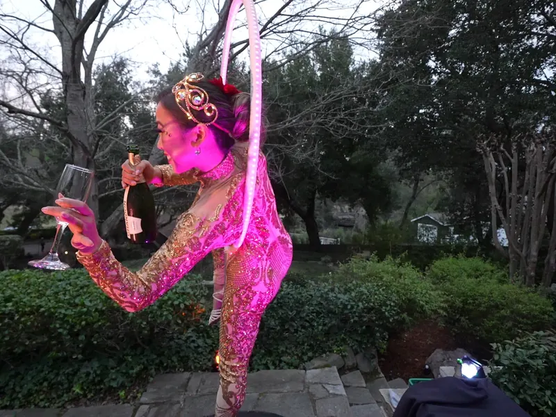 Entertainer performing beside the catering setup at a South Bay celebration