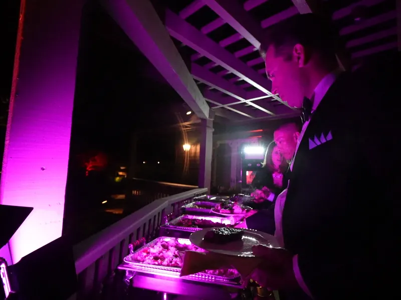 Warm buffet line lit for evening service at a Sunnyvale event